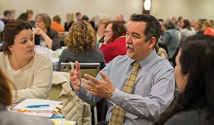 Mike Mattos meeting with educators